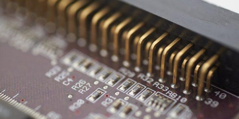 Circuit board macro illustrating the Anthropic security report on sandbox escapes