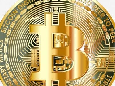 A physical Bitcoin coin, representing the BTC locked on the main chain behind a sidechain token