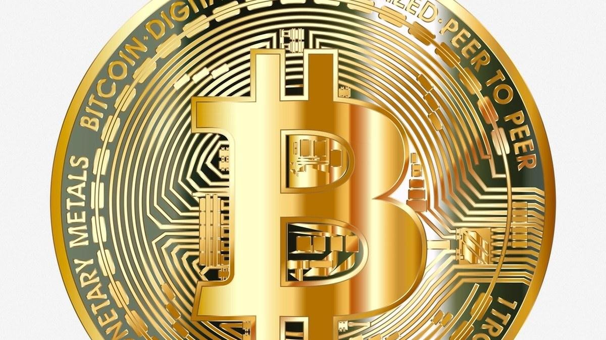 A physical Bitcoin coin, representing the BTC locked on the main chain behind a sidechain token