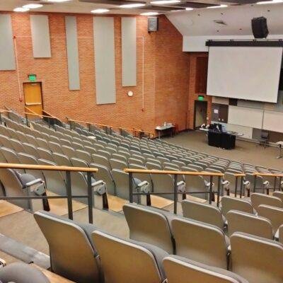 University lecture hall representing the OpenAI Navier-Stokes proof and the academic credit dispute